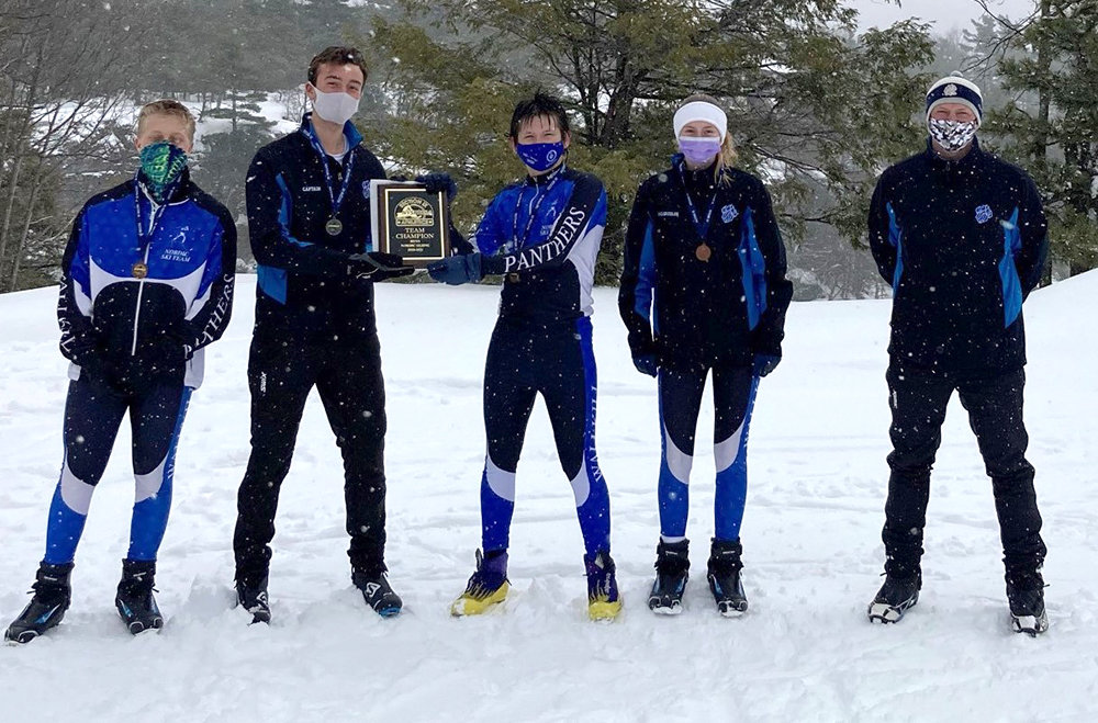 Members of the Wallkill Nordic Ski team pose with the Section 9 championship plaque on Feb. 23 at Minnewaska State Park.